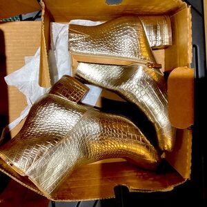 Ladies gold ankle boots.